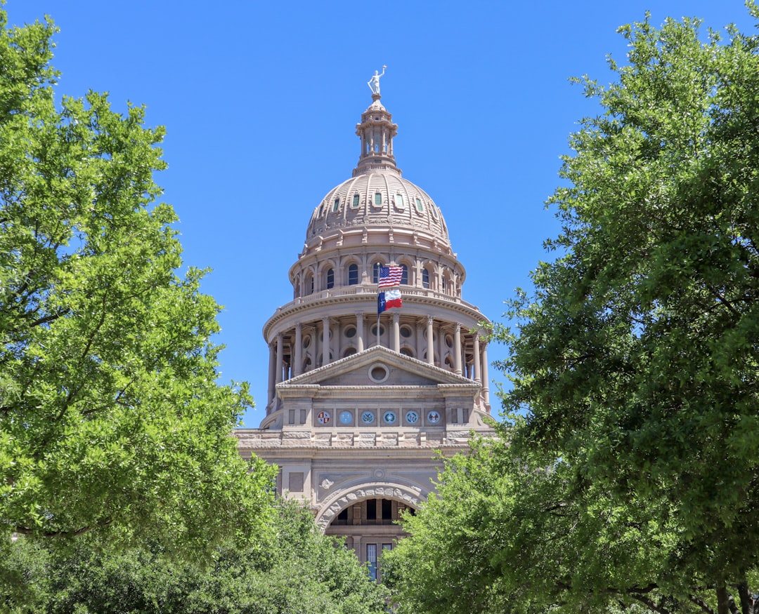State capitol building dome with flags