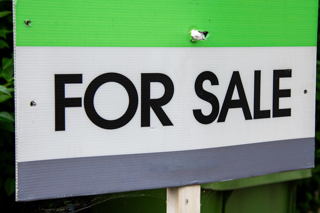 For sale sign in front of a house